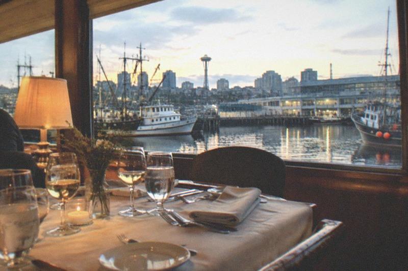 A set table on the water for the Seattle dinner cruise experience from Waterways Cruises & Events, a two and a half hour dining cruise departing from the Fishermen's Terminal dock area on Lake Union.