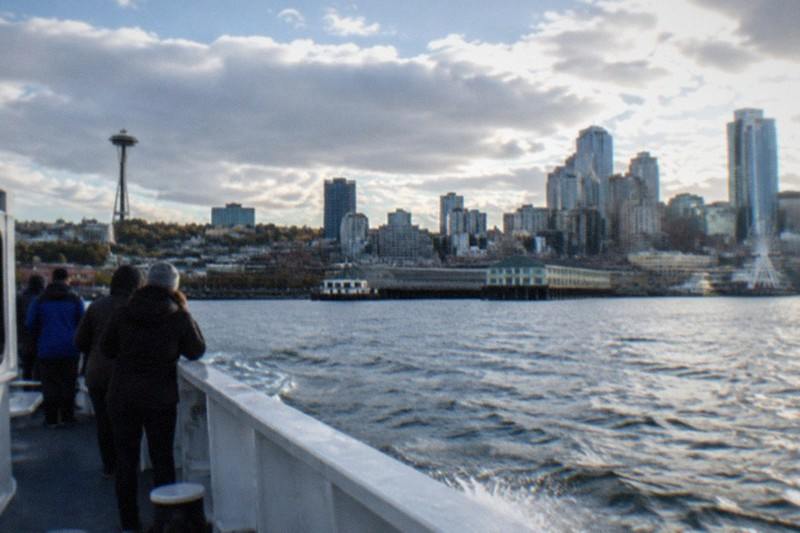 Passengers on deck with eyes on the water aboard the Seattle wildlife and whale watching cruise from Clipper Vacations, a three to five hour trip rated 4.5 across 653 reviews and priced from $150 per person.