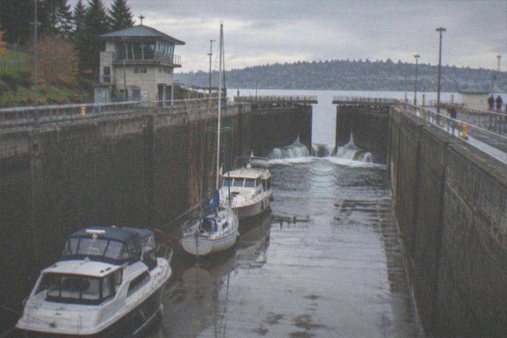 Pleasure boats waiting in the large lock chamber as water drains toward the saltwater side