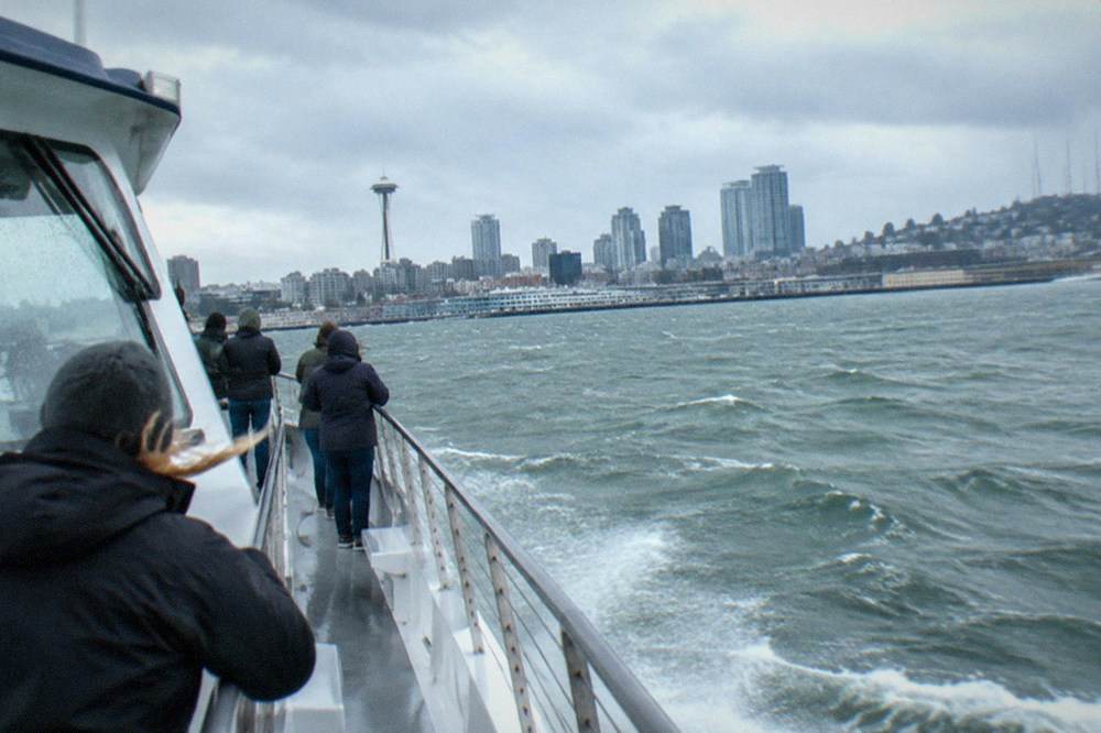 A whale watching boat with passengers on the upper deck in Puget Sound