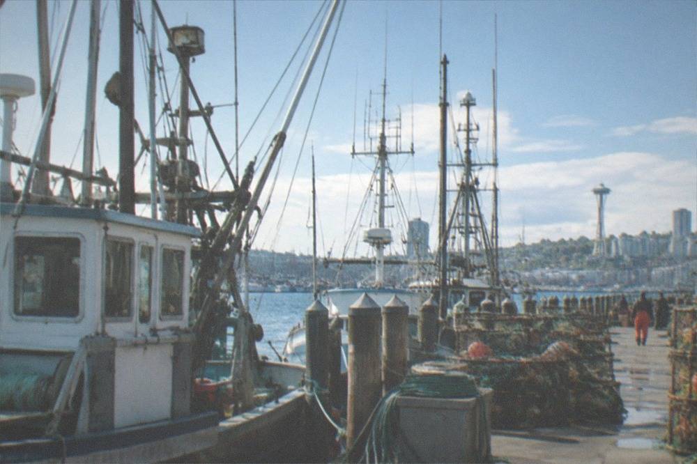 Fishing boats and masts at Fishermen's Terminal under a bright sky