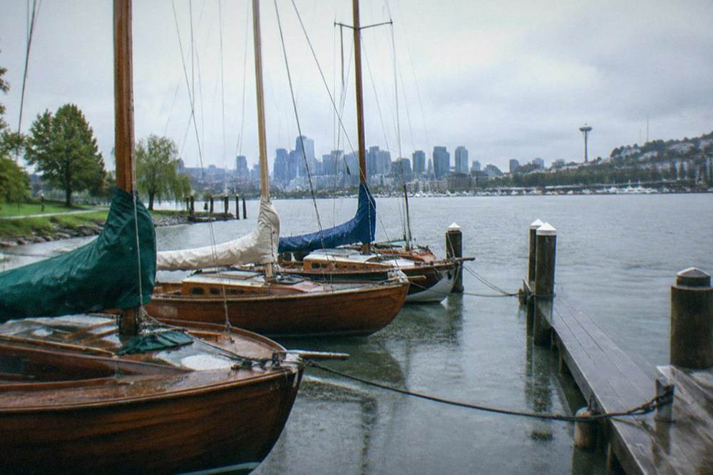 Wooden sailboats moored at the docks of the Center for Wooden Boats on Lake Union