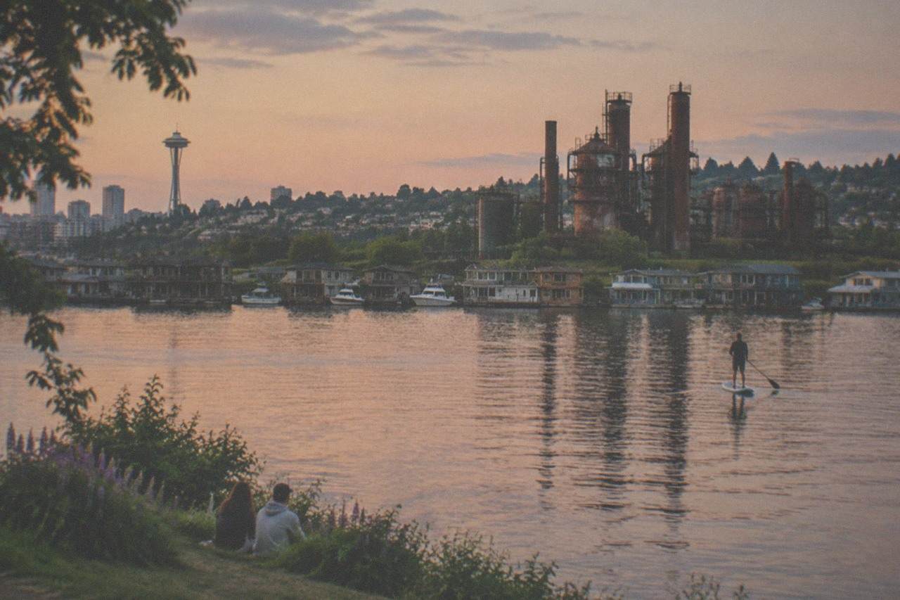 Quiet Seattle houseboats moored on Lake Union with the downtown skyline in soft evening light