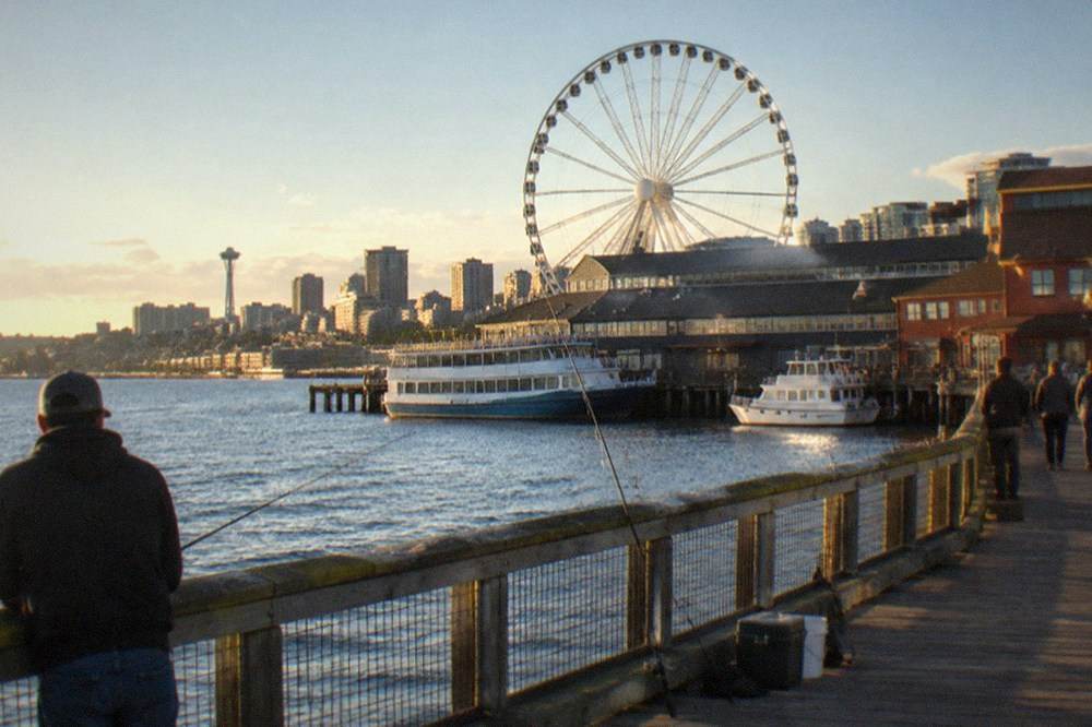 Seattle waterfront piers along Elliott Bay with the Great Wheel and moored vessels