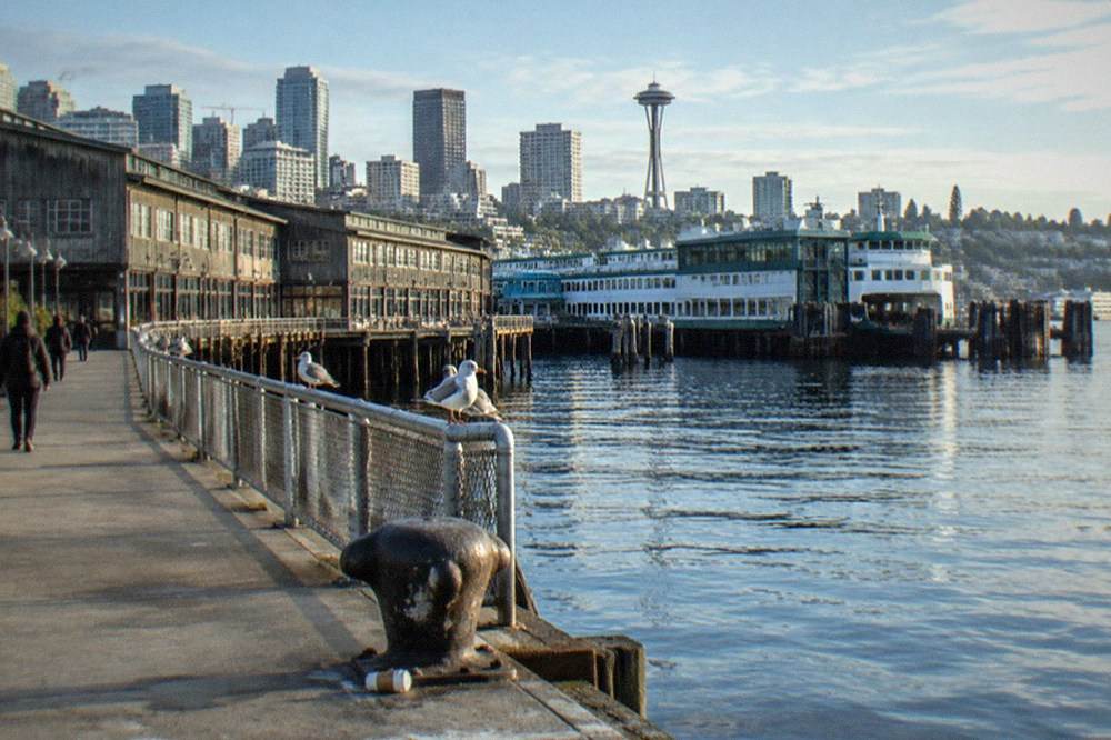 Ferry terminal and commercial piers along the Seattle waterfront on a clear day